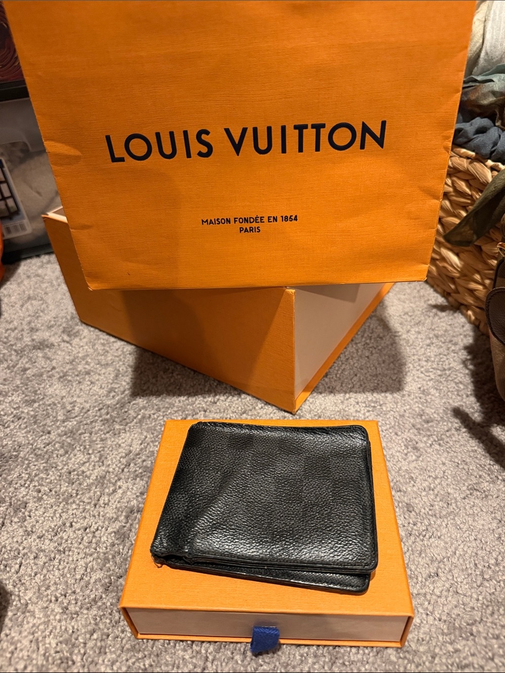 Louis Vuitton Black Leather Wallet with Pebbled Texture